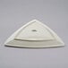 A white triangle shaped Tuxton china plate.