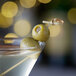 A Belosa martini with onion stuffed green olives on a stick.