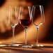 Three Chef & Sommelier wine glasses on a table.