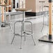 Lancaster Table & Seating metal bar stools with driftwood seats.