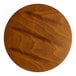 A Lancaster Table & Seating bar stool with a rustic walnut finish seat.
