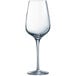A close-up of a clear Chef & Sommelier wine glass with a long stem.