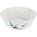 A white bowl with blue bamboo design on it.