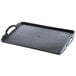 A black rectangular Dinex room service tray with handles.