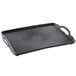 A black rectangular Dinex room service tray with handles.