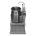 A stainless steel natural gas 12-gallon tilting steam jacketed tabletop kettle with control panel and faucet.