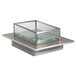 An Eastern Tabletop grey grain drop-in glass ice bin tile with a metal frame.