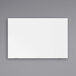 A white rectangular Luxor magnetic glass presentation board with black border on a gray wall.