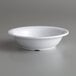 a white bowl on a gray surface