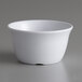 a white bowl on a white surface