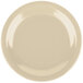 A tan Carlisle melamine plate with a white rim.