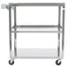 A Vollrath stainless steel utility cart with three shelves and wheels.