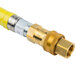 A yellow T&S Safe-T-Link gas hose with brass connectors.