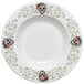 A white Fiesta china rim soup bowl with a skull and vine design in white.