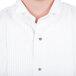 A close up of a white shirt with Henry Segal silver metal shirt studs with black stone finish.