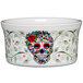 A white Fiesta ramekin with a skull and vine design on it.