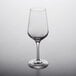 A Stolzle spirit taster glass on a white surface.