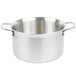 A silver Vollrath stainless steel sauce pot with handles.