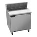 A Beverage-Air stainless steel refrigerated sandwich prep table with an open door on a counter.