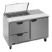 A Beverage-Air stainless steel refrigerated sandwich prep table with two drawers and clear lids.