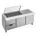 A Beverage-Air stainless steel refrigerated sandwich prep table with drawers and clear lids.