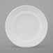 A Tuxton Alaska bright white china plate with a wide white rim.