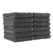 A stack of Monarch Brands charcoal grey hand towels.