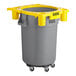 A grey and yellow Lavex commercial trash can on a dolly.