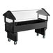 A black 6-foot portable youth food or salad bar with an open base, clear sneeze guard, and wheels for mobility.