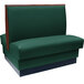 A green booth seat with a wooden frame.