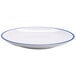 A white GET Settlement Bistro melamine dinner plate with a blue rim.