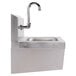 An Advance Tabco stainless steel hand sink with a knee operated faucet.