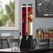 A black and white tall double beer tower with a blurry black and white background.