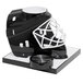 A black and white hockey helmet with a beer tube on top.