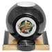 A Beer Tubes tall bowling ball beer tower with a black and white ball on a wooden surface.