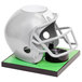 A gray football helmet on a green Beer Tubes tower.