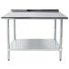 An Advance Tabco stainless steel work table with a shelf.