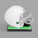 A white football helmet-shaped beer tower on a green surface.