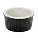 A black and eggshell fluted ceramic Tuxton ramekin with a white rim.