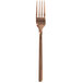 A close up of a Walco stainless steel dinner fork with a rose gold handle.