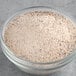 A bowl of UPOURIA Pumpkin Spice Cappuccino mix powder.
