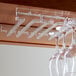 A Franmara acrylic rack holding wine glasses.