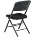A black Lifetime folding padded chair with a black cushion.