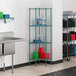 Regency green metal wire pentagon corner shelves in a school kitchen.