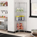 A Regency chrome wire pentagon corner shelf kit in a kitchen with shelves and a pantry.