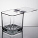 A Libbey clear square glass container with a clear lid.