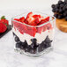 a glass of fruit in a square container