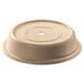 A beige plastic Cambro plate cover with a hole.