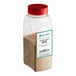 A plastic container of brown powder with a label for Regal Granulated Onion.