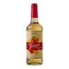 A Torani Puremade Peach Flavoring Syrup 750 mL glass bottle with a label.